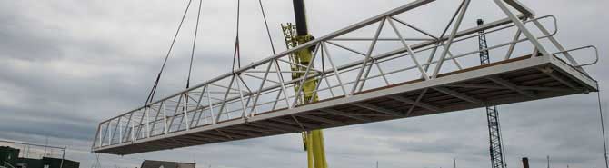 Bridge lifted into place as challenging marina project draws to a close