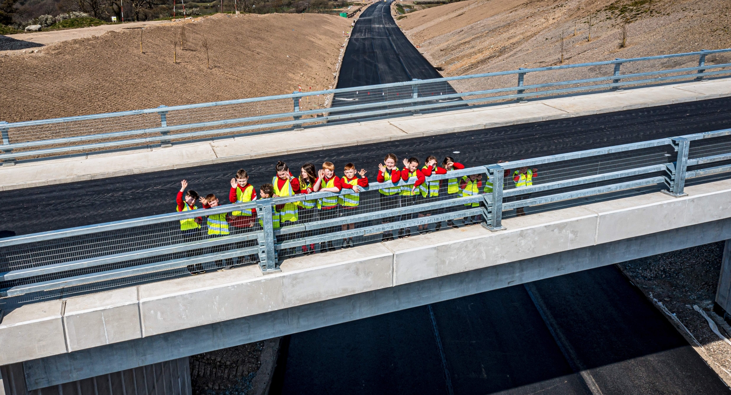 Schoolchildren cut the ribbon at new bridge following year of closures